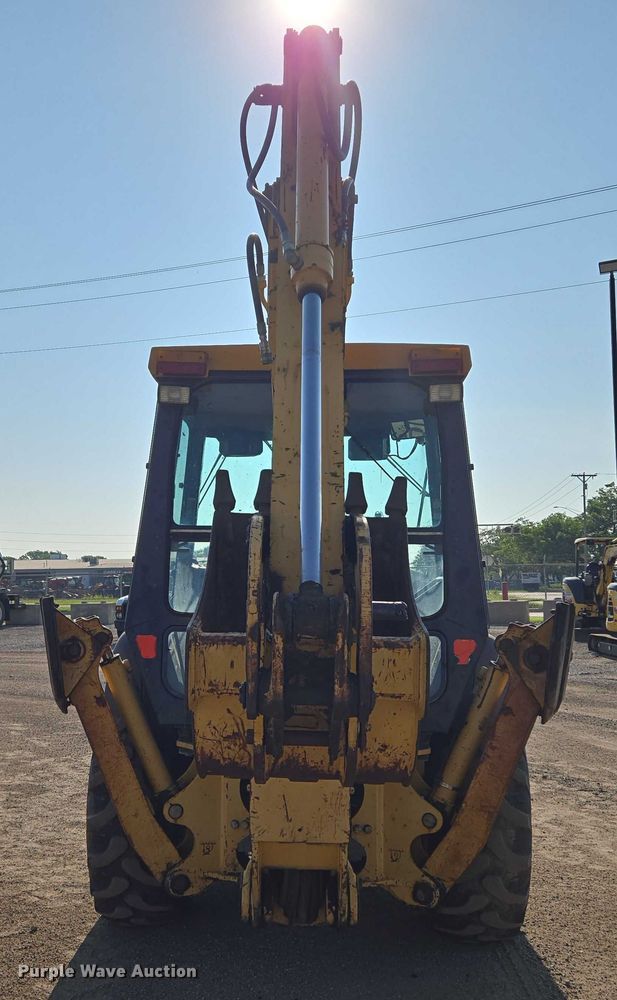 image for item EN8327 1999 John Deere 310E backhoe