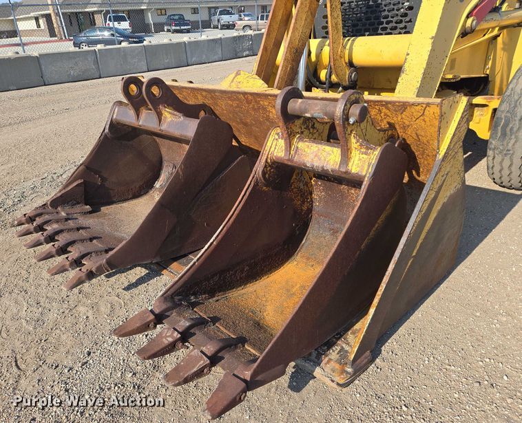 image for item EN8327 1999 John Deere 310E backhoe