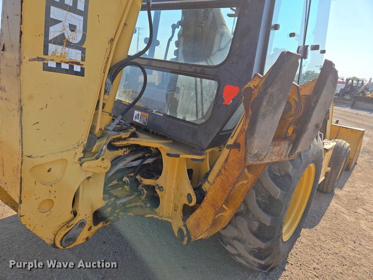 image for item EN8327 1999 John Deere 310E backhoe