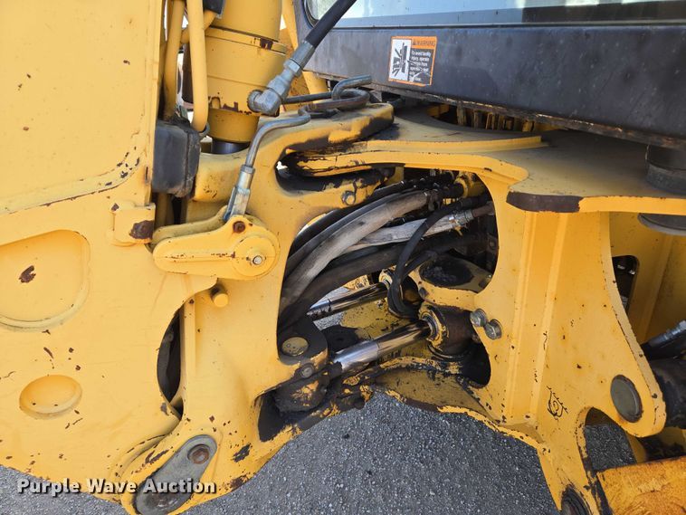 image for item EN8327 1999 John Deere 310E backhoe