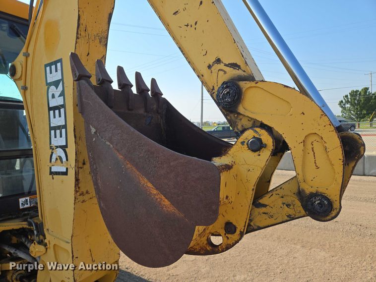 image for item EN8327 1999 John Deere 310E backhoe