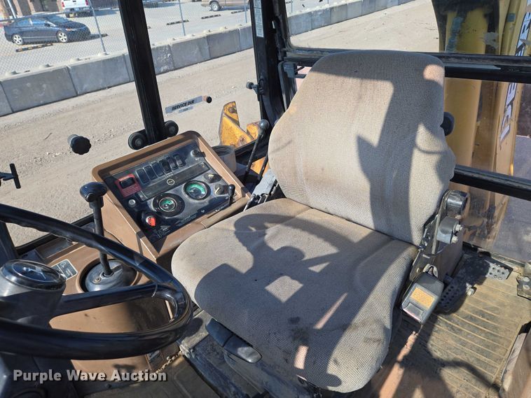 image for item EN8327 1999 John Deere 310E backhoe