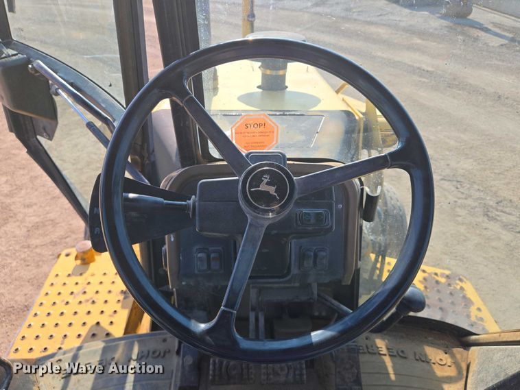 image for item EN8327 1999 John Deere 310E backhoe