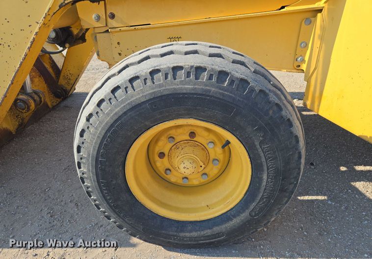 image for item EN8327 1999 John Deere 310E backhoe