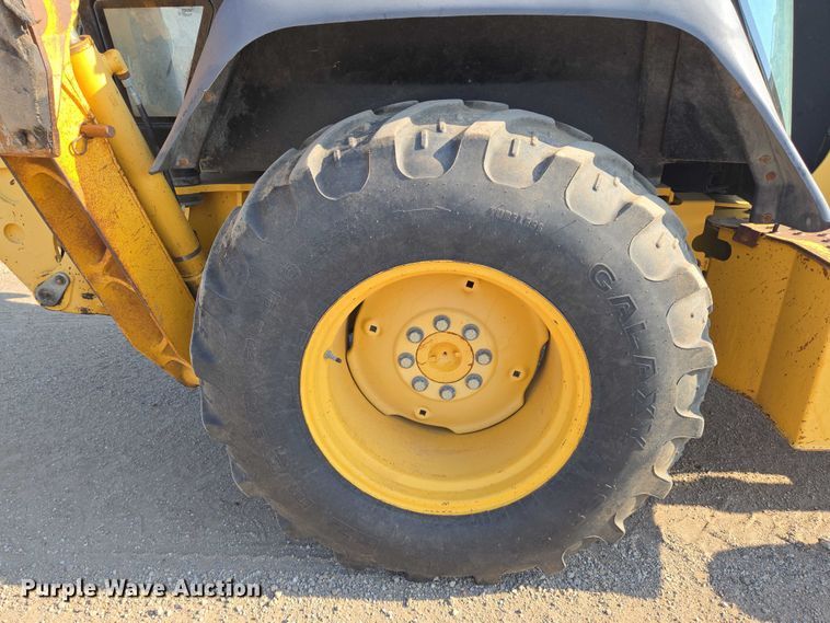 image for item EN8327 1999 John Deere 310E backhoe