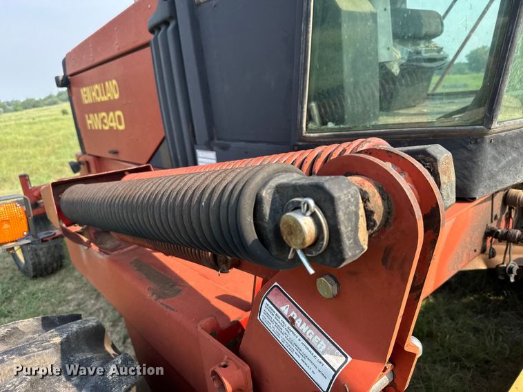 image for item ER2118 1999 New Holland HW340 swather / windrower