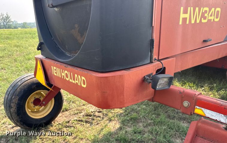 image for item ER2118 1999 New Holland HW340 swather / windrower