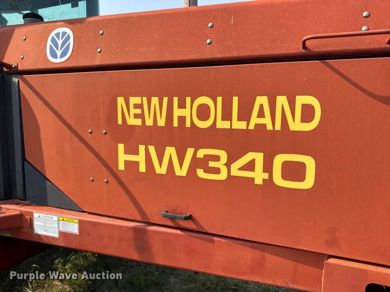 image for item ER2118 1999 New Holland HW340 swather / windrower