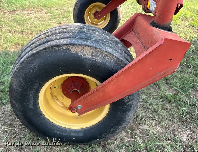image for item ER2118 1999 New Holland HW340 swather / windrower