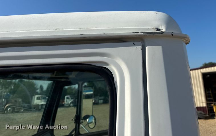 image for item DW3495 1999 Freightliner FL60 flatbed truck