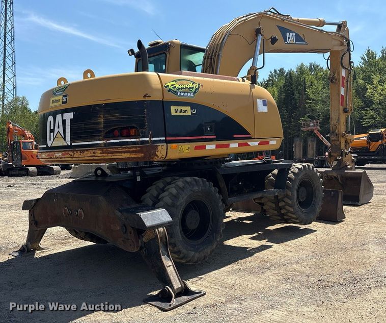 image for item EC4360 2004 Caterpillar M316C wheeled excavator