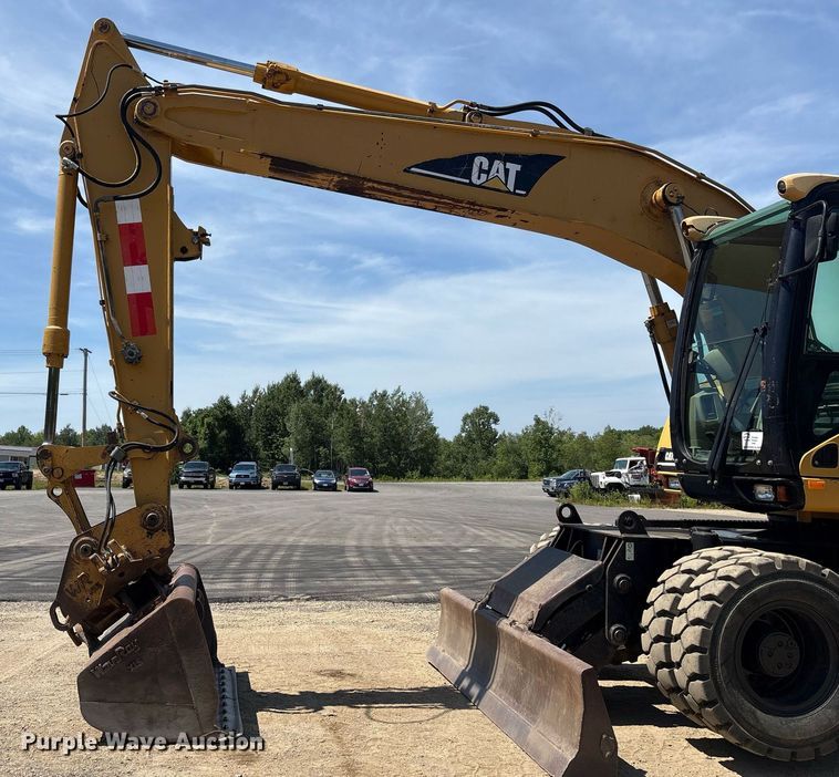 image for item EC4360 2004 Caterpillar M316C wheeled excavator