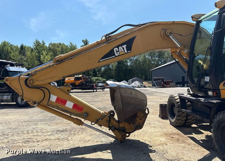 image for item EC4360 2004 Caterpillar M316C wheeled excavator