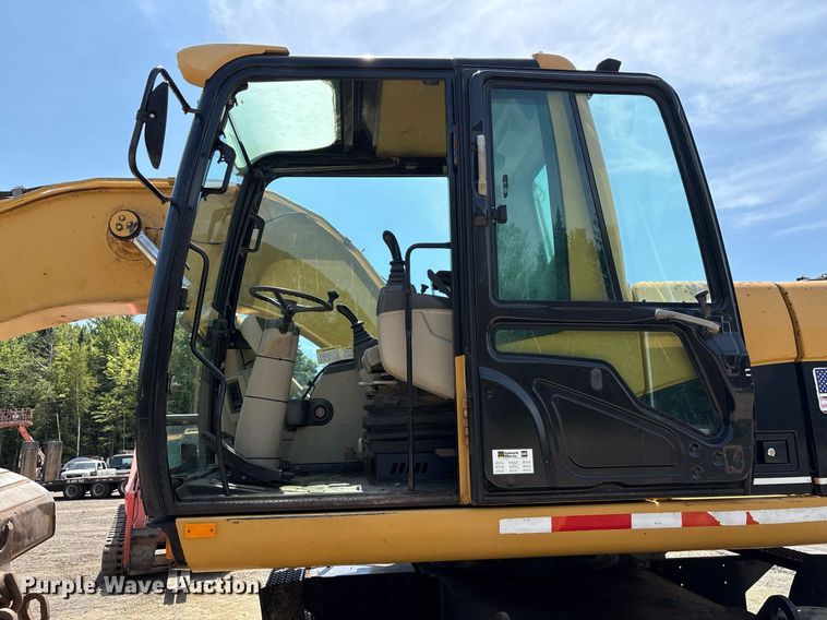 image for item EC4360 2004 Caterpillar M316C wheeled excavator