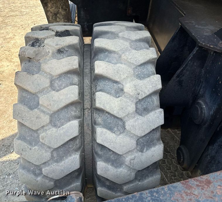 image for item EC4360 2004 Caterpillar M316C wheeled excavator