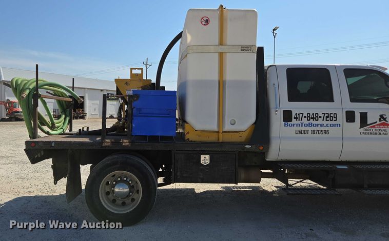 image for item ED2173 2007 Ford F650 XLT Super Duty Crew Cab flatbed truck with mud mixing system