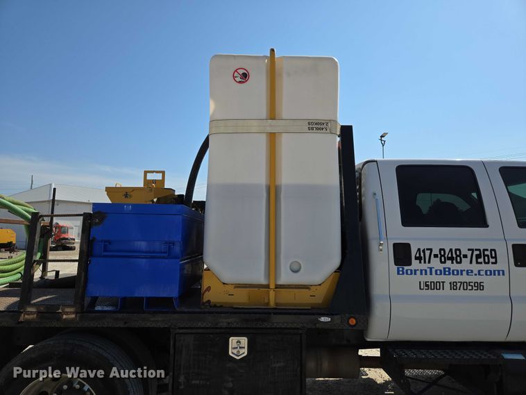 image for item ED2173 2007 Ford F650 XLT Super Duty Crew Cab flatbed truck with mud mixing system