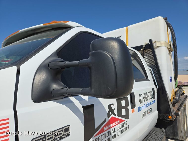 image for item ED2173 2007 Ford F650 XLT Super Duty Crew Cab flatbed truck with mud mixing system