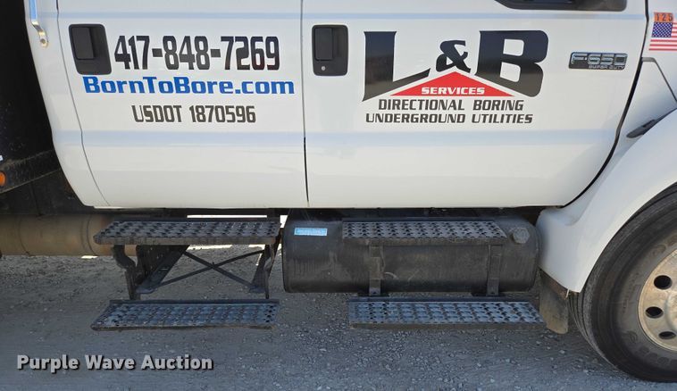 image for item ED2173 2007 Ford F650 XLT Super Duty Crew Cab flatbed truck with mud mixing system