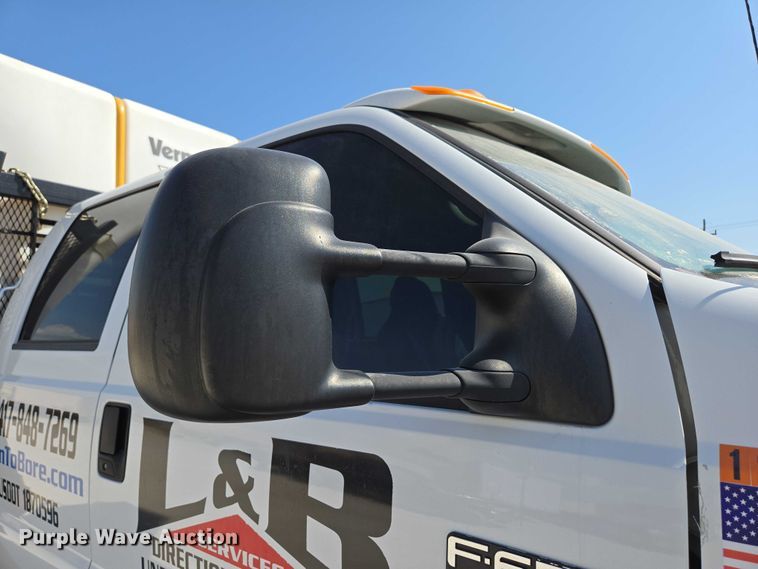 image for item ED2173 2007 Ford F650 XLT Super Duty Crew Cab flatbed truck with mud mixing system