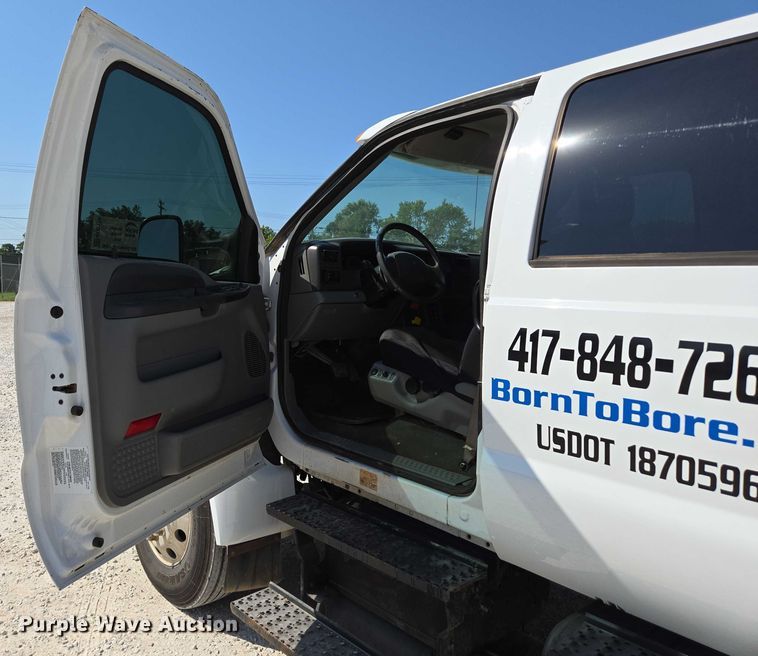 image for item ED2173 2007 Ford F650 XLT Super Duty Crew Cab flatbed truck with mud mixing system