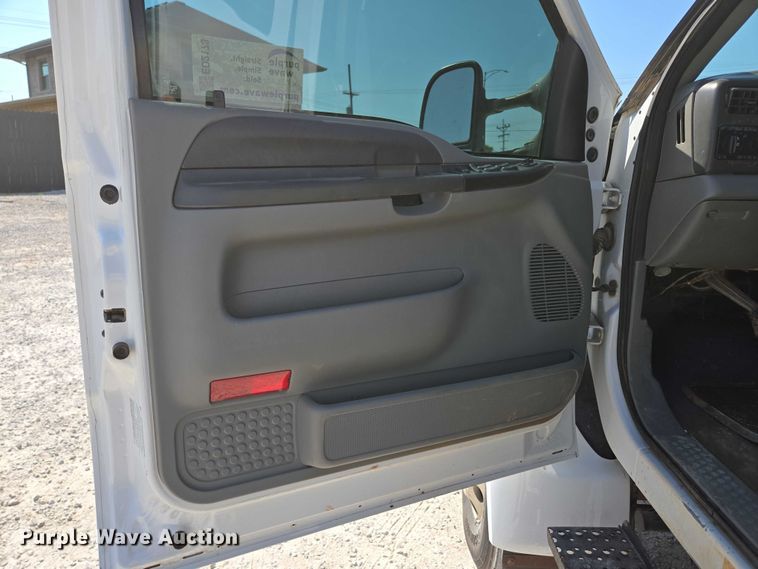 image for item ED2173 2007 Ford F650 XLT Super Duty Crew Cab flatbed truck with mud mixing system