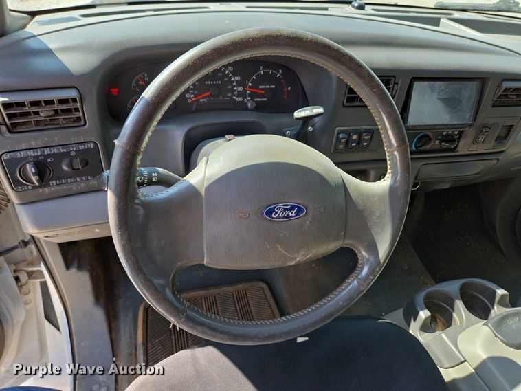 image for item ED2173 2007 Ford F650 XLT Super Duty Crew Cab flatbed truck with mud mixing system