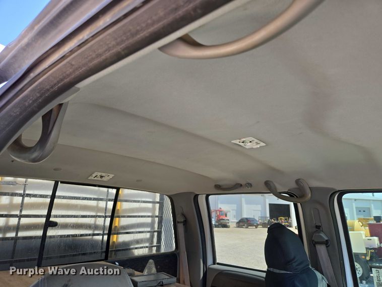 image for item ED2173 2007 Ford F650 XLT Super Duty Crew Cab flatbed truck with mud mixing system