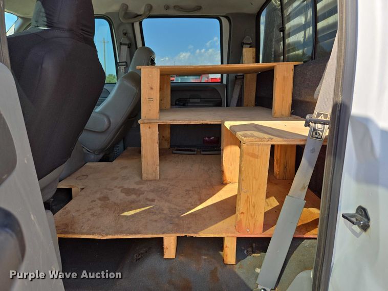 image for item ED2173 2007 Ford F650 XLT Super Duty Crew Cab flatbed truck with mud mixing system