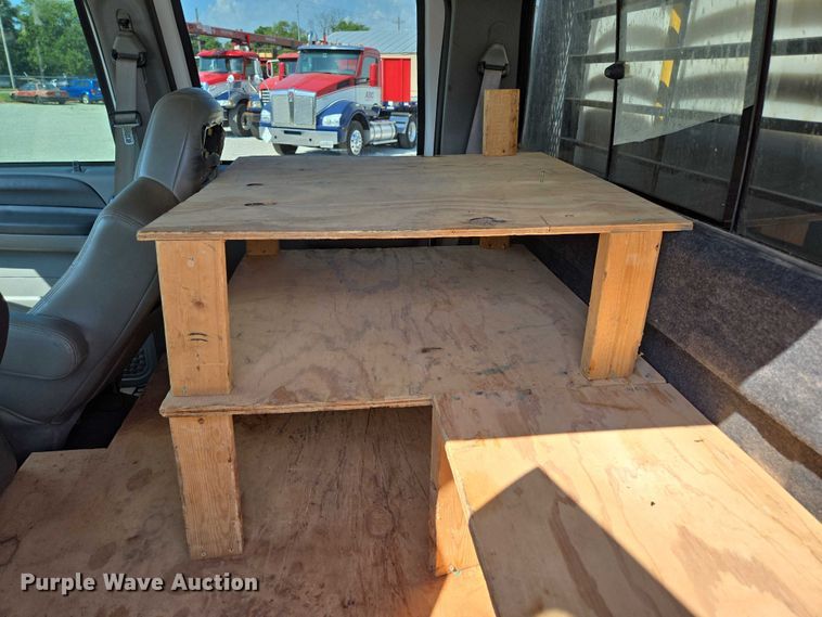 image for item ED2173 2007 Ford F650 XLT Super Duty Crew Cab flatbed truck with mud mixing system