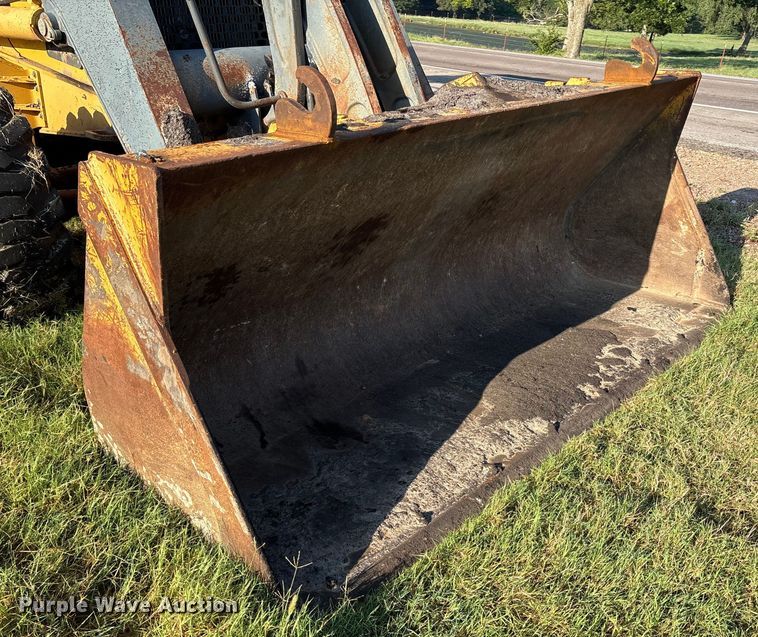 image for item EM0575 2009 John Deere 710J landscape tractor