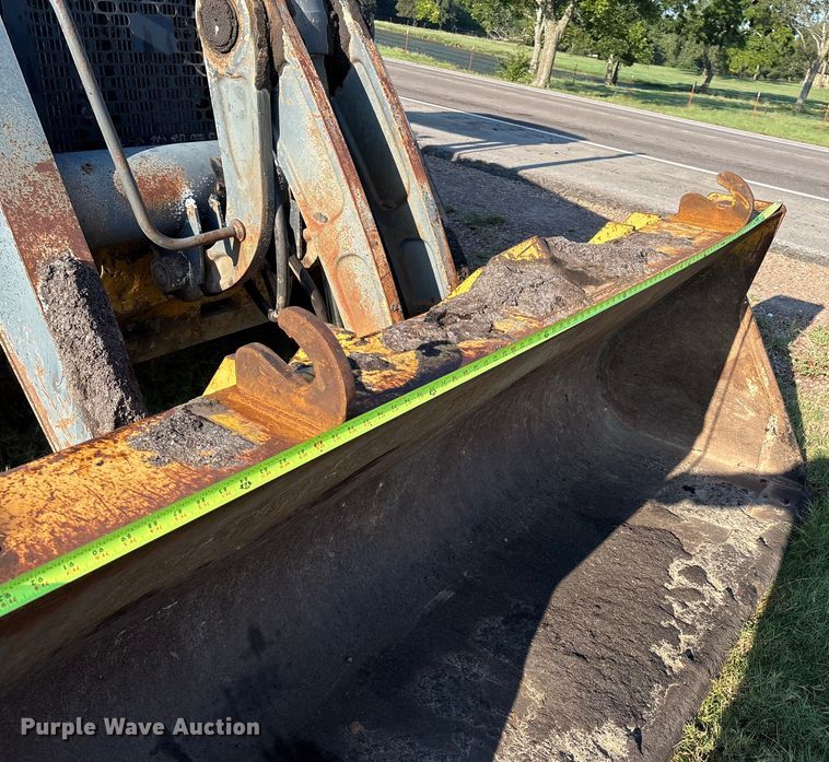 image for item EM0575 2009 John Deere 710J landscape tractor