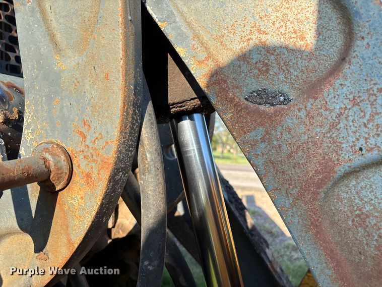 image for item EM0575 2009 John Deere 710J landscape tractor