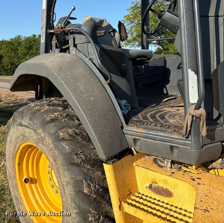 image for item EM0575 2009 John Deere 710J landscape tractor