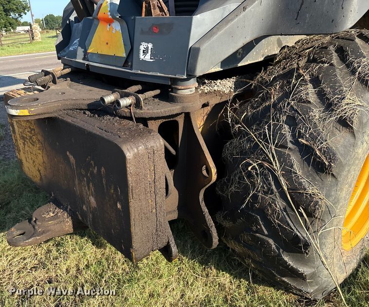 image for item EM0575 2009 John Deere 710J landscape tractor