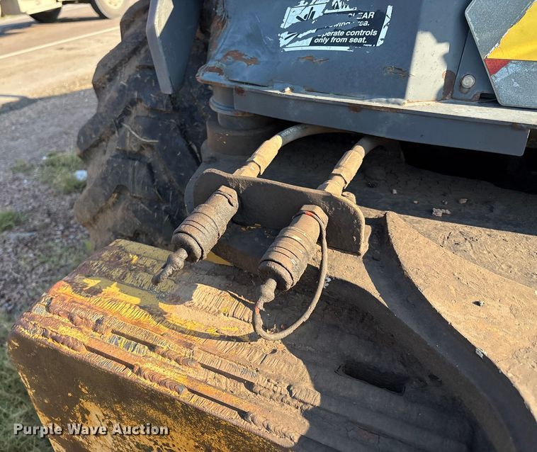 image for item EM0575 2009 John Deere 710J landscape tractor