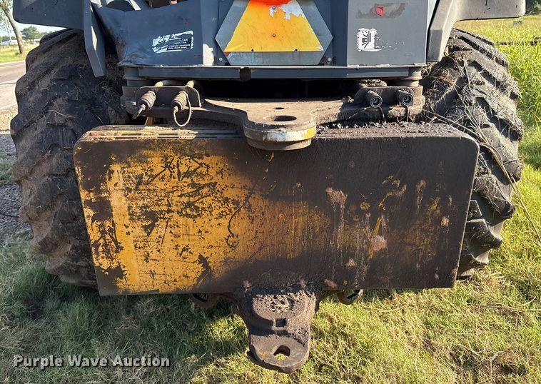 image for item EM0575 2009 John Deere 710J landscape tractor