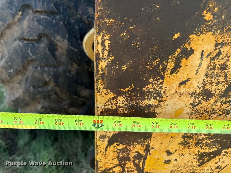 image for item EM0575 2009 John Deere 710J landscape tractor