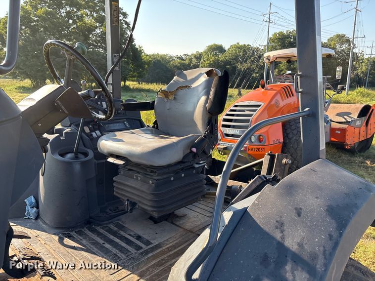 image for item EM0575 2009 John Deere 710J landscape tractor