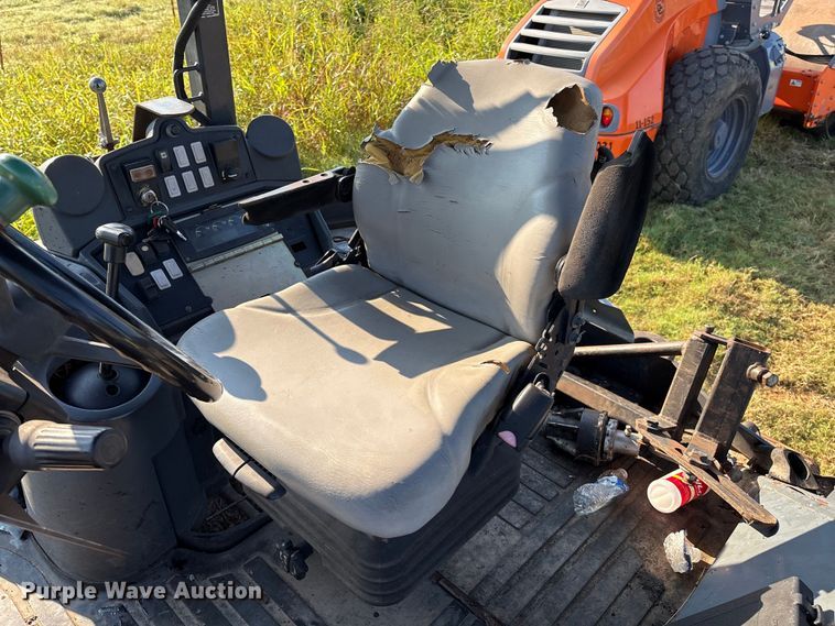 image for item EM0575 2009 John Deere 710J landscape tractor