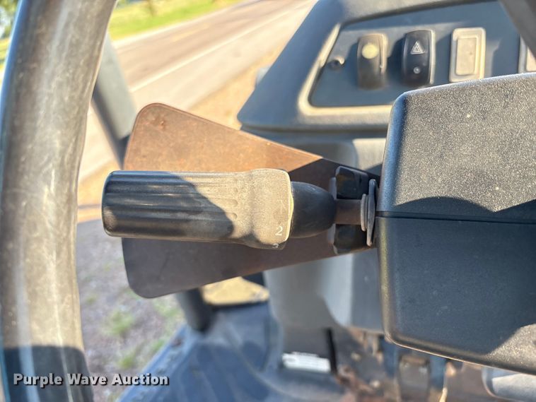 image for item EM0575 2009 John Deere 710J landscape tractor