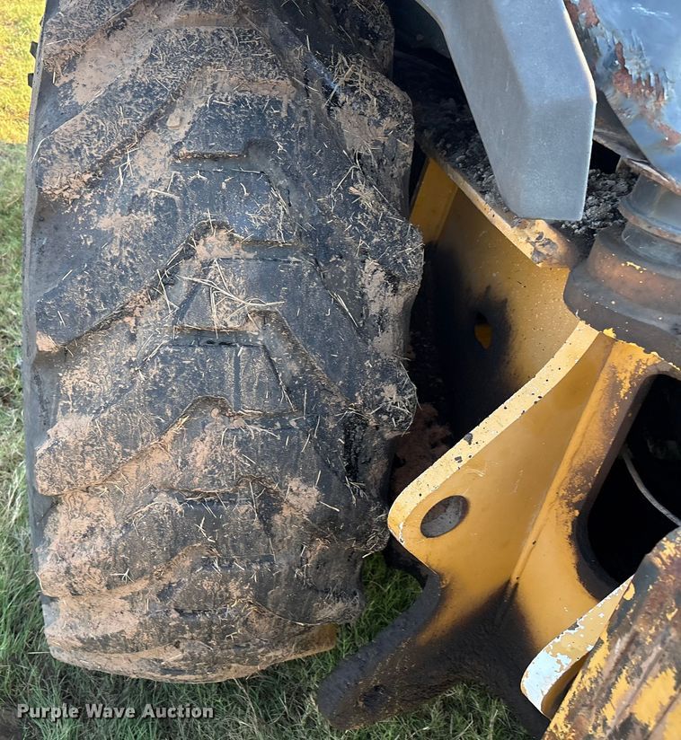 image for item EM0575 2009 John Deere 710J landscape tractor