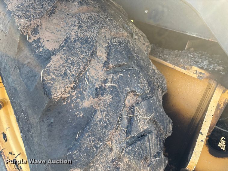 image for item EM0575 2009 John Deere 710J landscape tractor