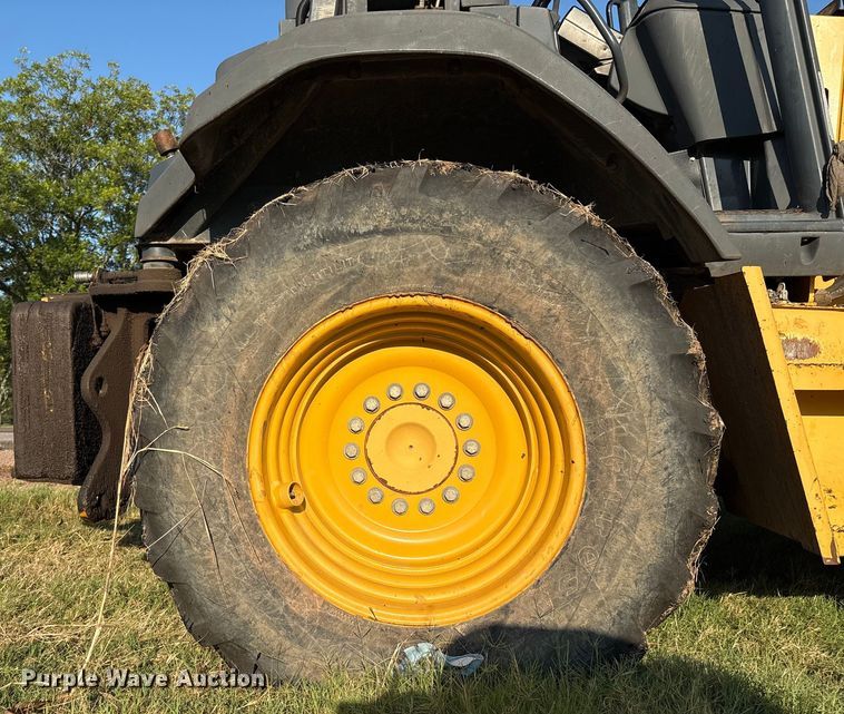 image for item EM0575 2009 John Deere 710J landscape tractor