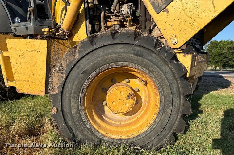 image for item EM0575 2009 John Deere 710J landscape tractor