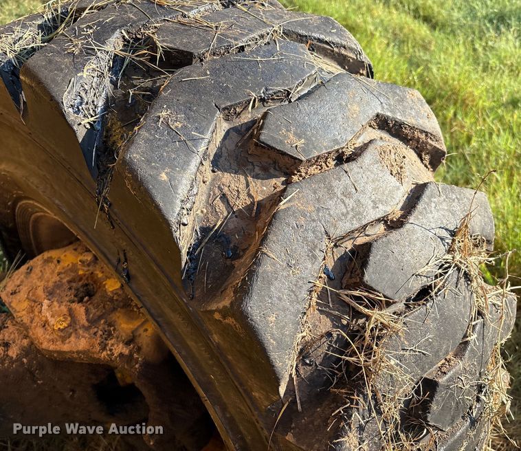 image for item EM0575 2009 John Deere 710J landscape tractor