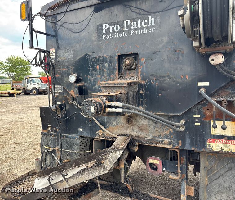 image for item EN8444 2012 Freightliner Business Class M2 pothole patcher truck
