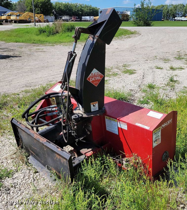 image for item DX7423 New Holland Red Devel skid steer snow blower