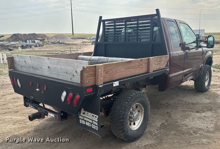 image for item ER2260 2000 Ford F250 Super Duty SuperCab flatbed pickup truck