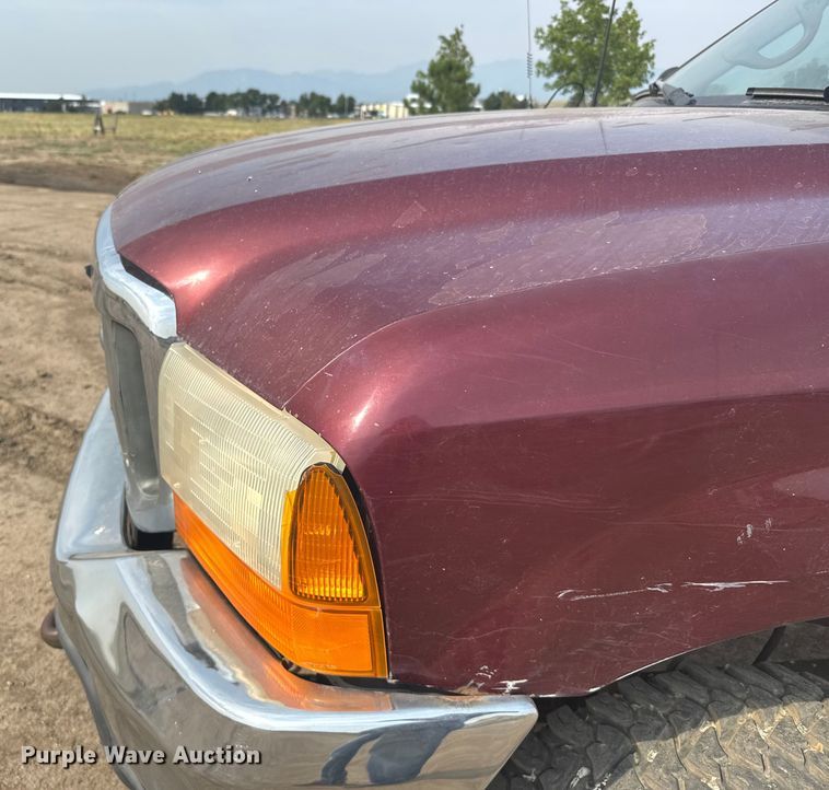 image for item ER2260 2000 Ford F250 Super Duty SuperCab flatbed pickup truck